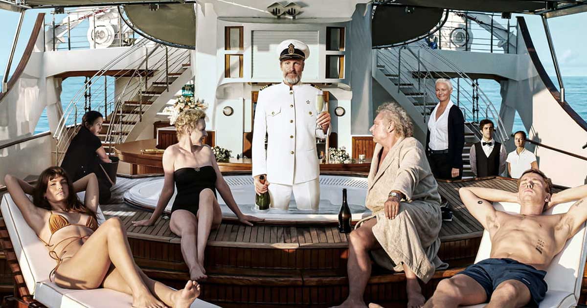 Charlbi Dean, Dolly de Leon, Sunnyi Melles, Woody Harrelson, Zlatko Burić, Vicki Berlin and Harris Dickinson in Triangle of Sadness.
